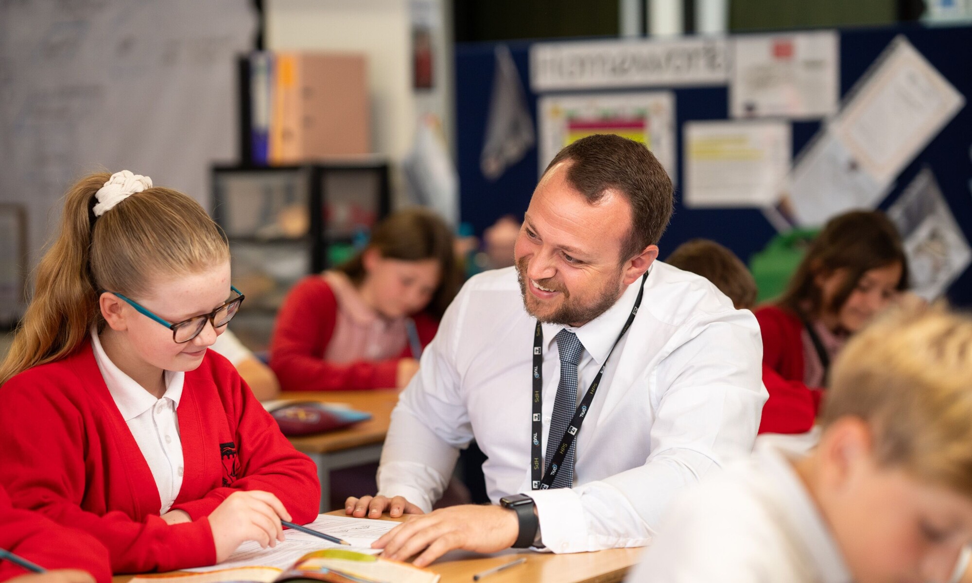 Heybridge Primary School teacher helping pupil