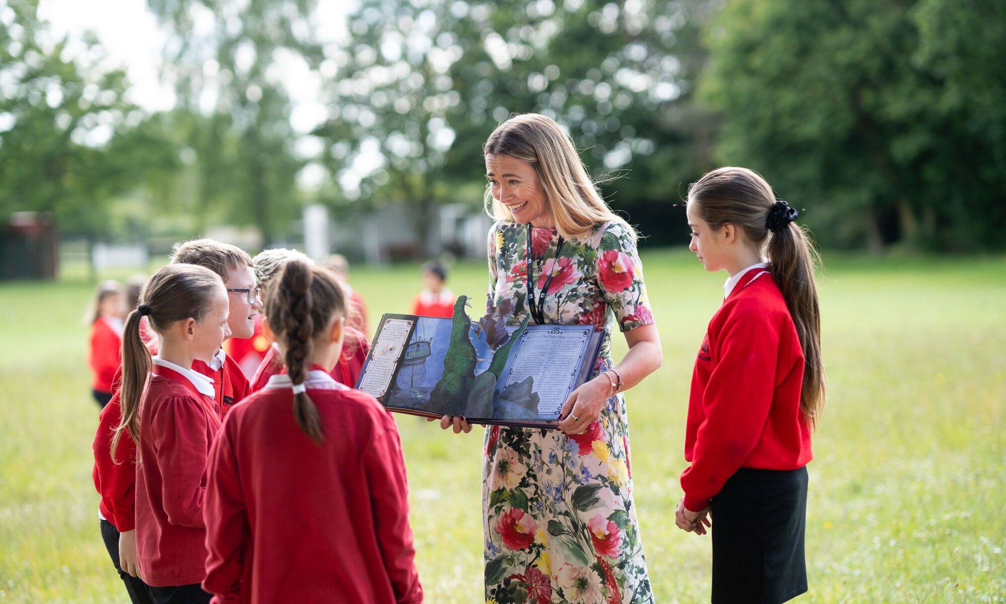 Heybridge Primary School pupils and teacher on the school field
